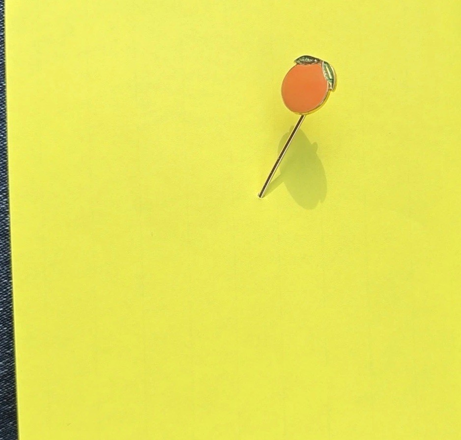 A Happy Vintage Orange Stickpin